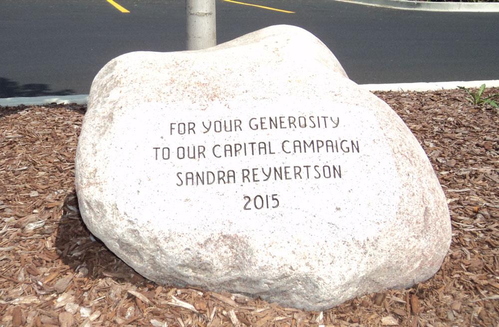 Boulder with engraved text for donor recognition