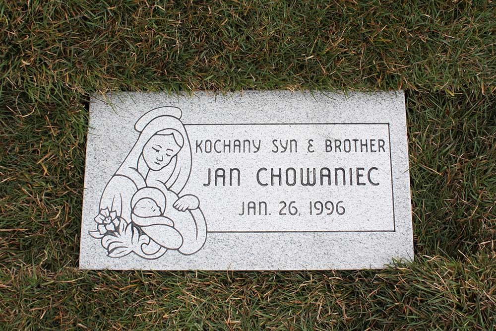 Child's marker with Mary carving and Polish lettering