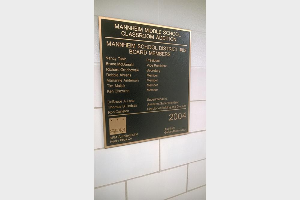 Commemorative bronze plaque at a school
