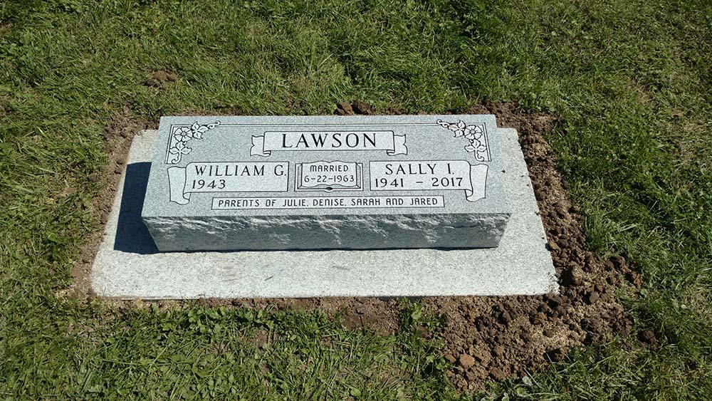 Companion bevel marker on granite foundation with marriage date in book panel