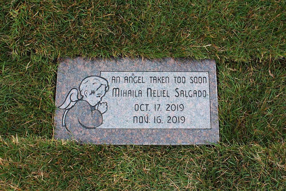 Mahogany granite Childs marker with angel carving