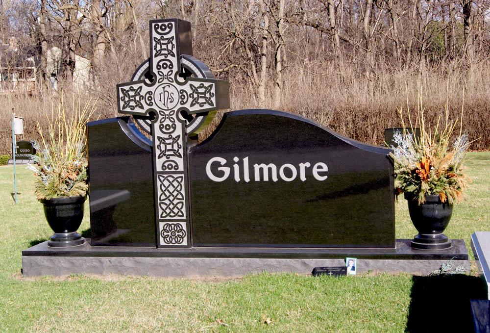 Family monument in black granite with a celtic cross