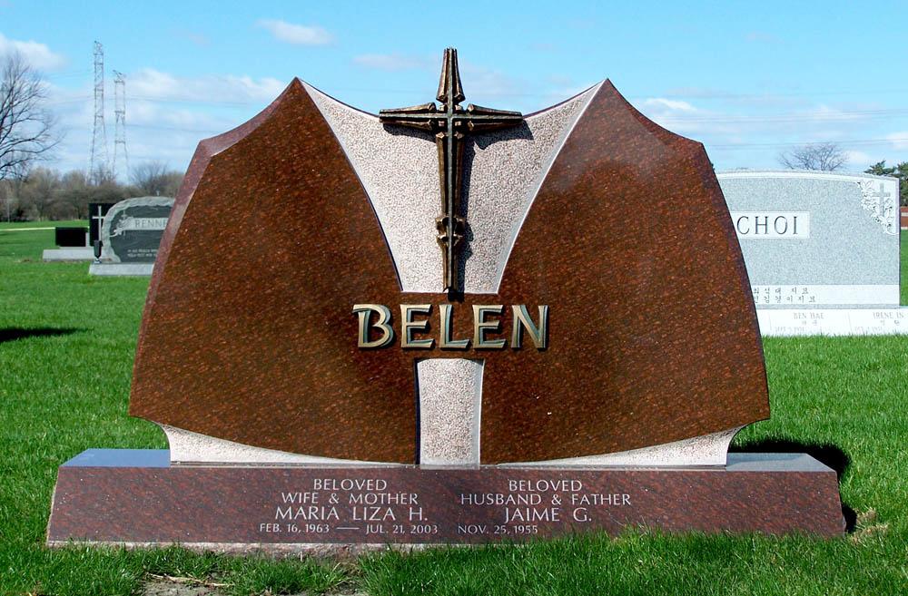 Family monument in brown granite with bronze cross