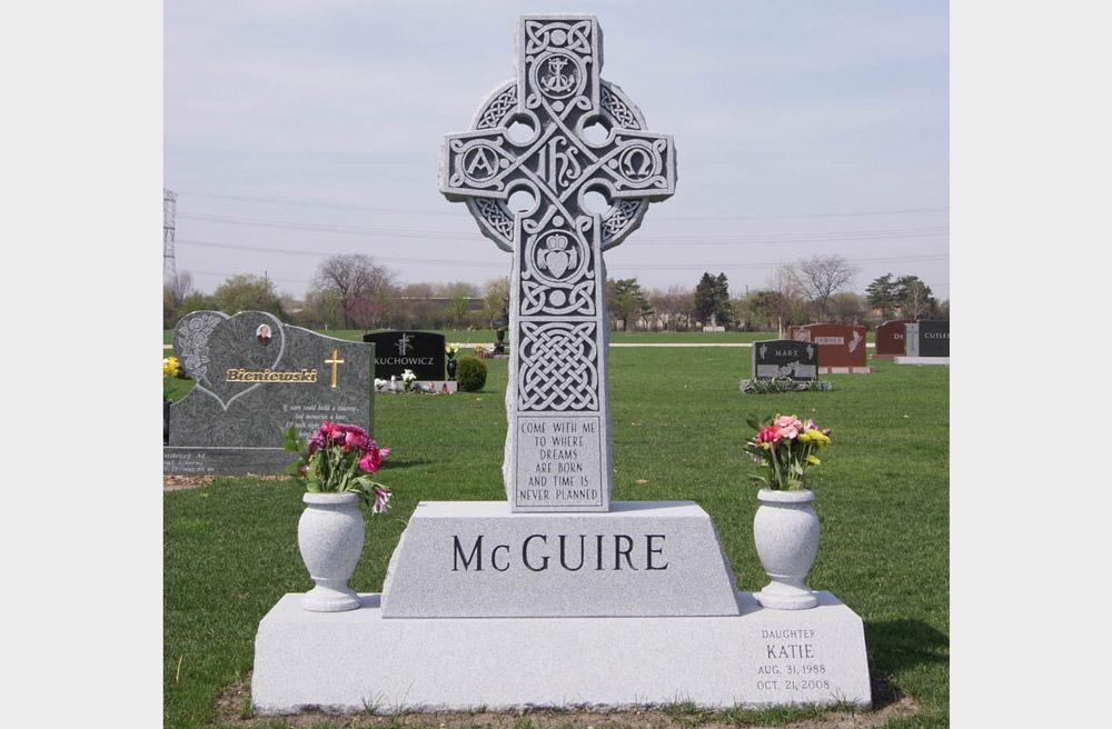 Family monument in grey granite with Celtic cross and vases