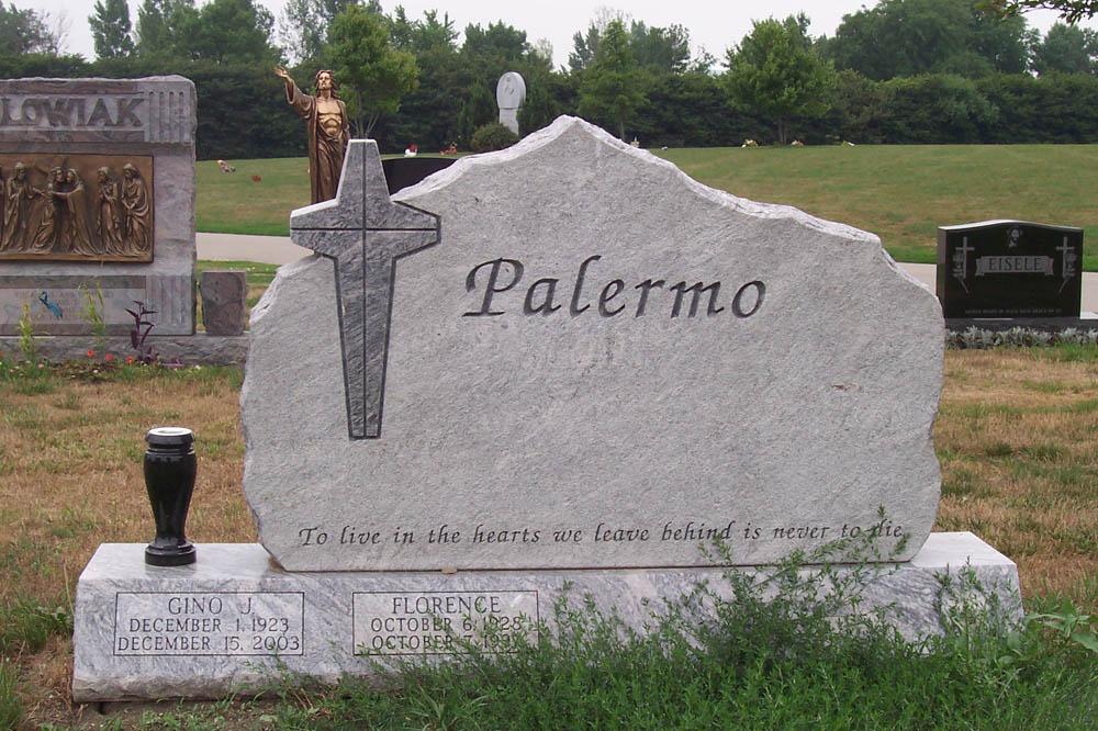 Family monument in grey granite with a cross