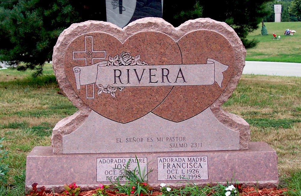Heart shaped family monument in rose colored granite