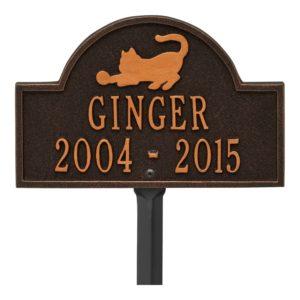 Small rubbed bronze plaque finish with image of cat and dates