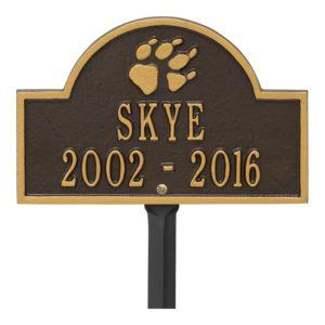Small bronze and gold plaque finish with image of dog paw and dates