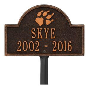 Small bronze plaque finish with image of dog paw and dates