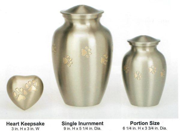 Three sizes and shapes of gold urn with printed paw prints